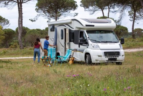 RV owners standing outside there RV home