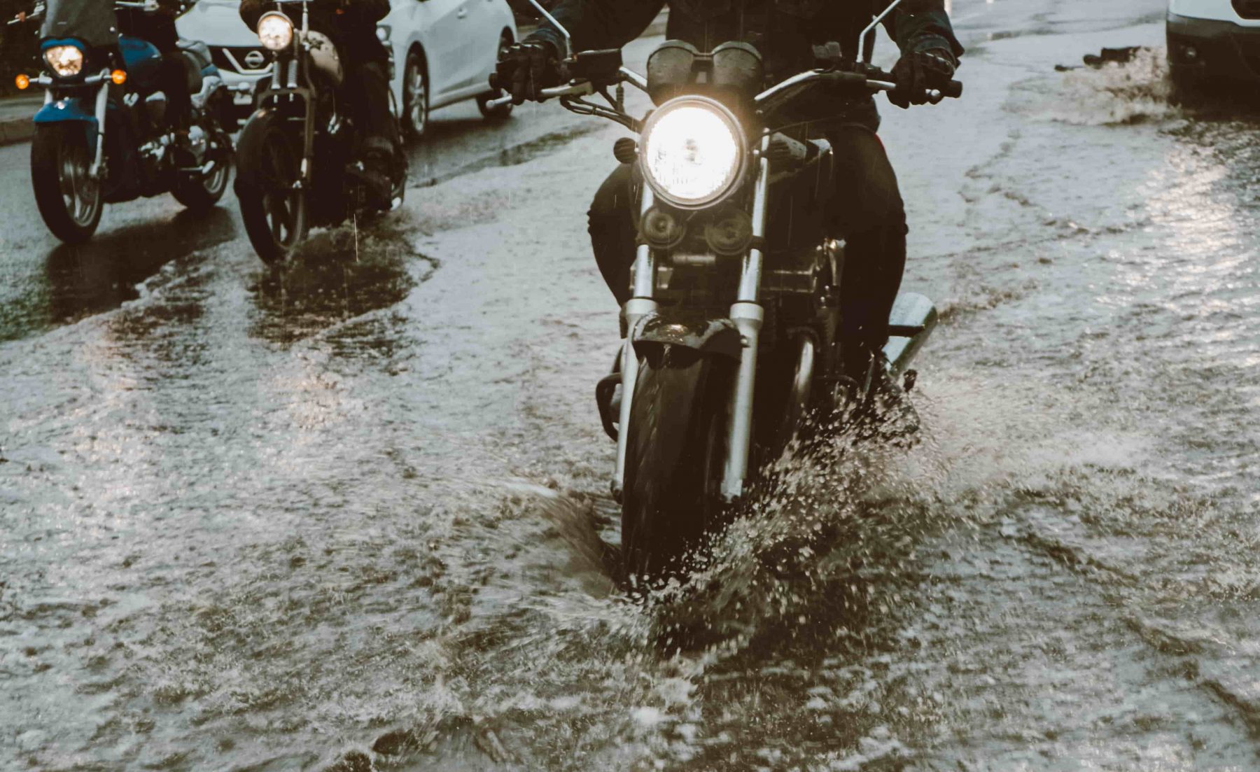 motorcycle moving in flood