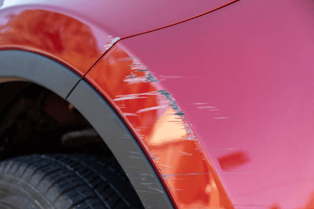 Close-up of a scratch in car paint in Arkansas