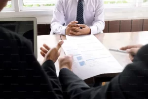 a group discussing life insurance payouts in Arkansas