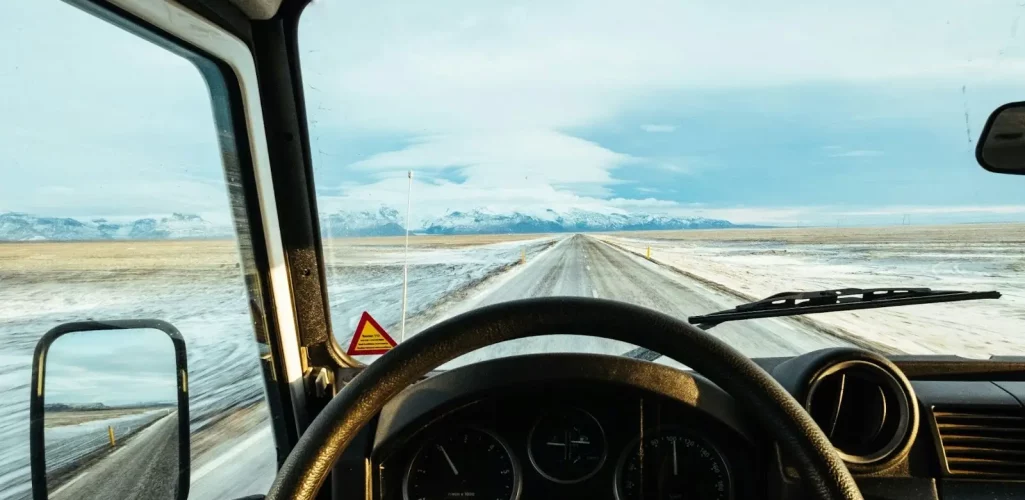 A man driving a commercial box truck