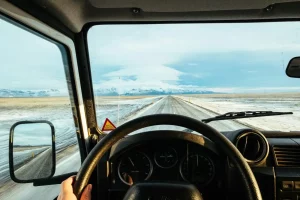 A man driving a commercial box truck