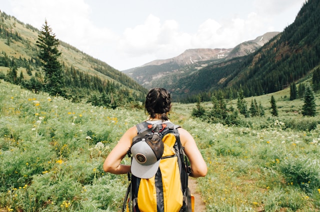 Girl Facing Mountains And Green Landscape