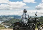 a man sitting on motorcycle